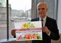 Foto von Bürgerschaftspräsident Christian Weber mit einem Banner der Veranstaltung